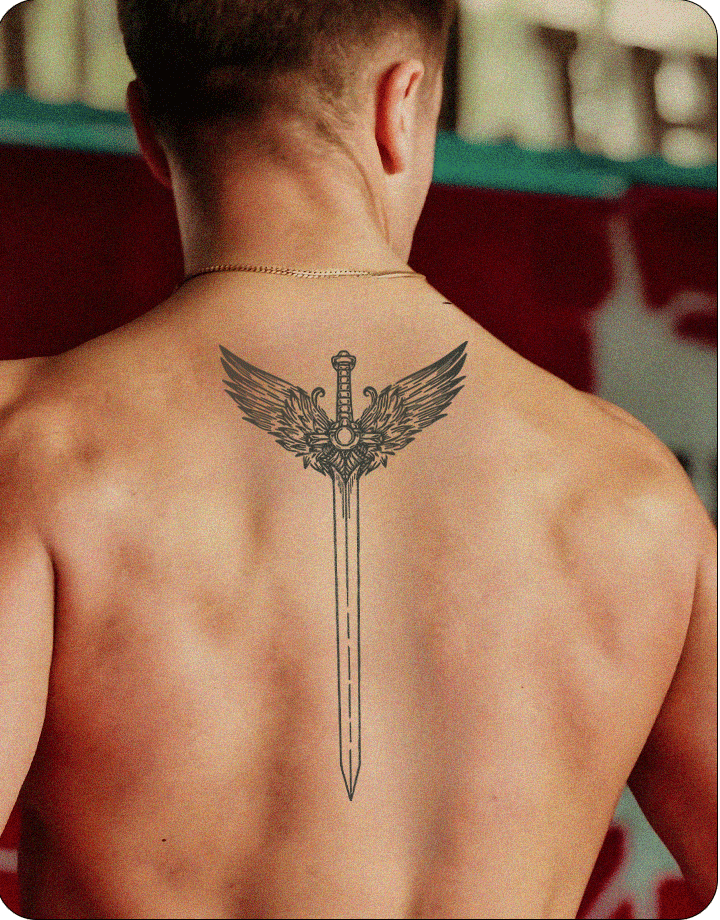 Back tattoo of a detailed sword with angel wings, inked in black and placed centrally on the upper back.